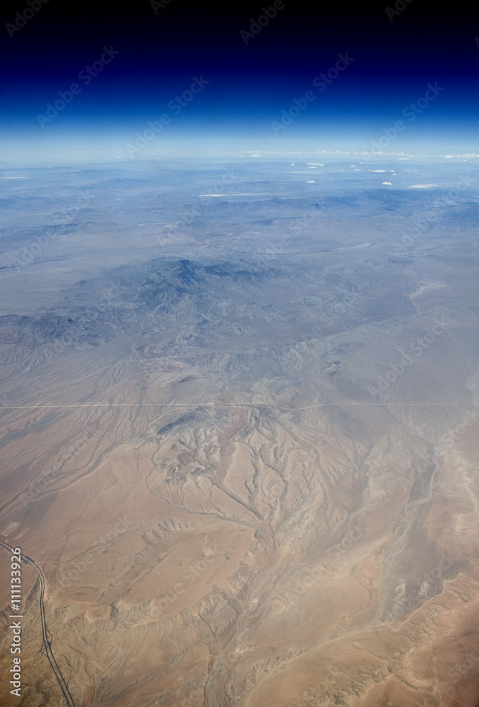 Fototapeta premium Aerial view of the Earth in space. The desert in the western United States.