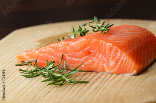 Raw salmon on cutting board