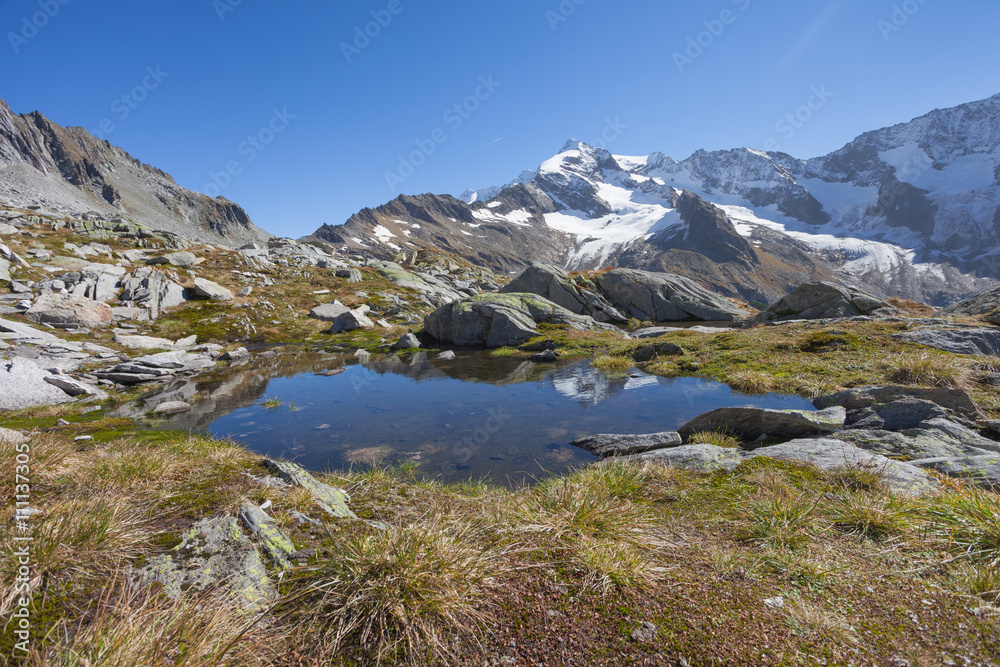 small mountain lake long an high path in South Tyrol
