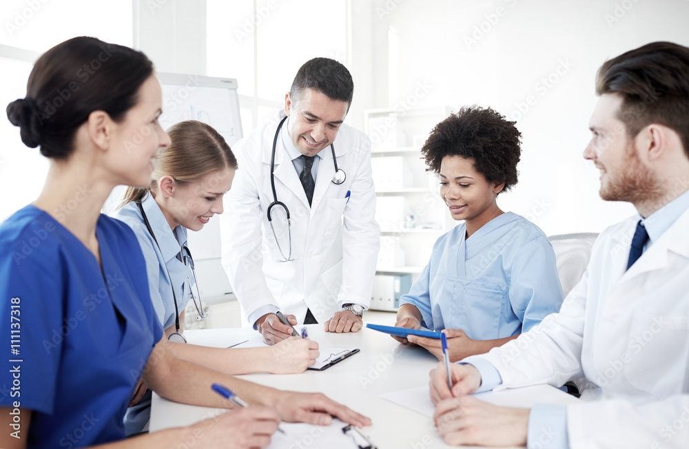 group of happy doctors meeting at hospital office group of happy doctors meeting at hospital office