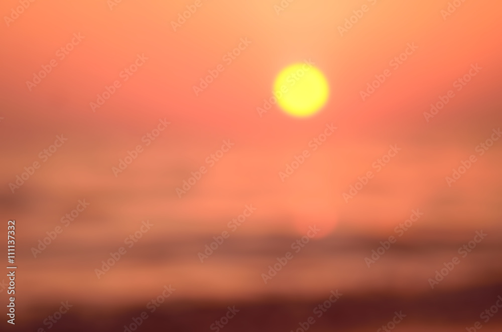 Blur tropical sunset beach with bokeh sun light wave abstract background. Travel concept.