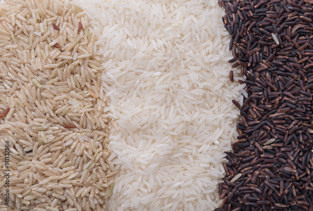 Food background with three rows of rice varieties : brown rice