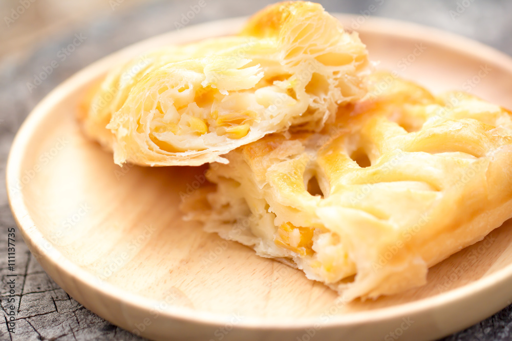 Corn pastry pie in wooden dish Corn pastry pie in wooden dish