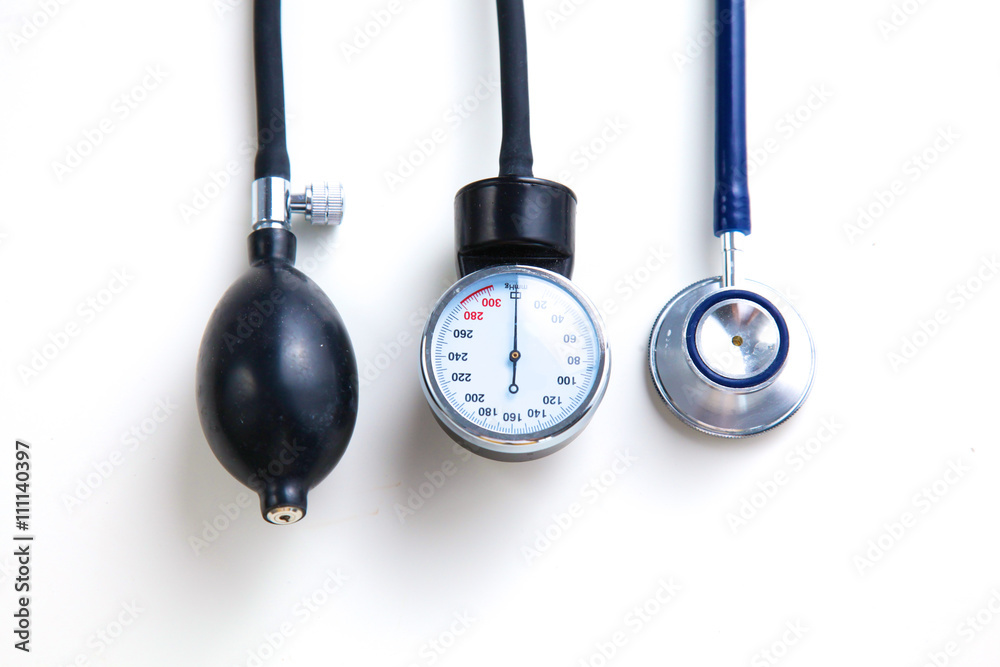 Silver stethoscope lying down on an laptop, toned blue Silver stethoscope lying down on an laptop, toned blue