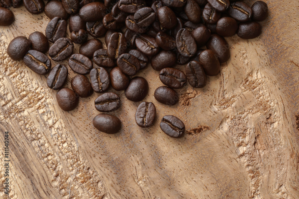 Naklejka premium Coffee on wooden background