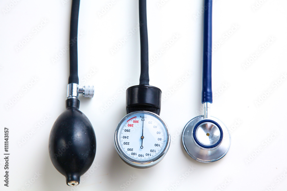Silver stethoscope lying down on an laptop, toned blue Silver stethoscope lying down on an laptop, toned blue