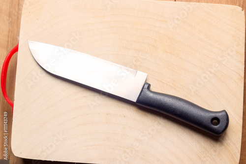 plastic kitchen knife on wood block