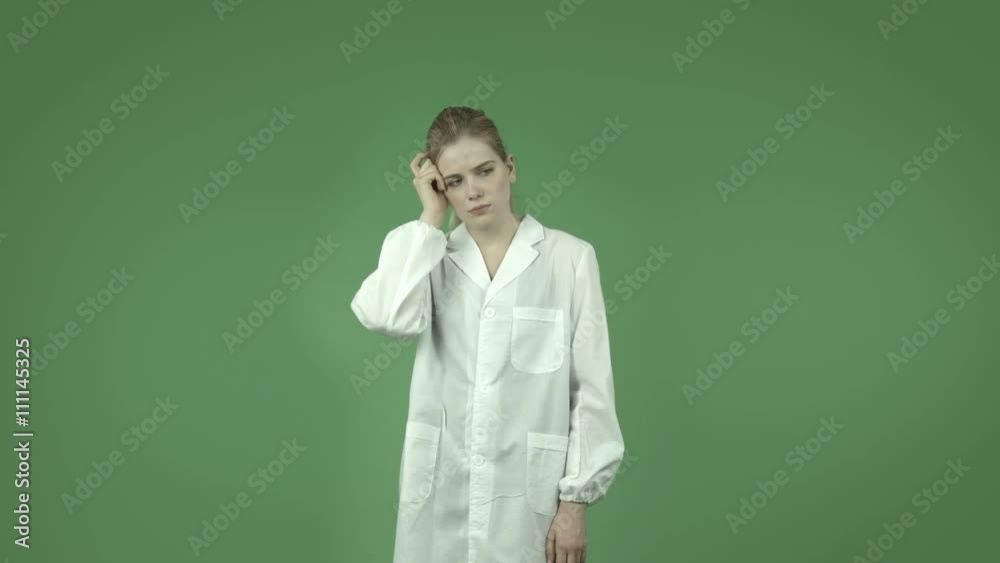 attractive caucasian girl with lab coat isolated on green thinking scratching head attractive caucasian girl with lab coat isolated on green thinking scratching head