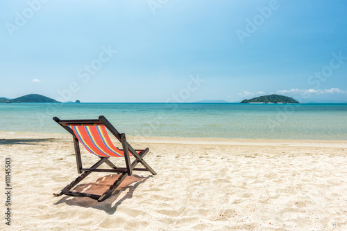 Beach chairs on the white sand beach, Beautiful beach and tropical sea, Wave of the sea on the sand beach