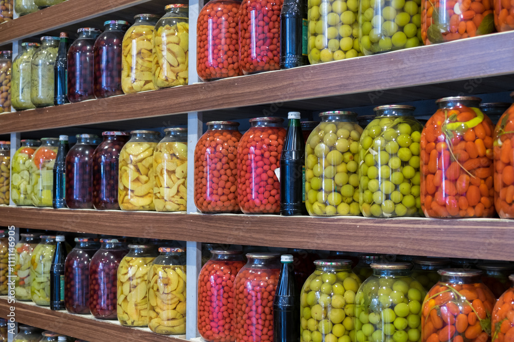 Pickled fruits and vegetables for sale at city market. Baku. Aze Pickled fruits and vegetables for sale at city market. Baku. Aze