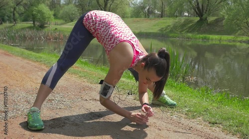 2in 1 video. Girl stretching after running in the park.
 photo