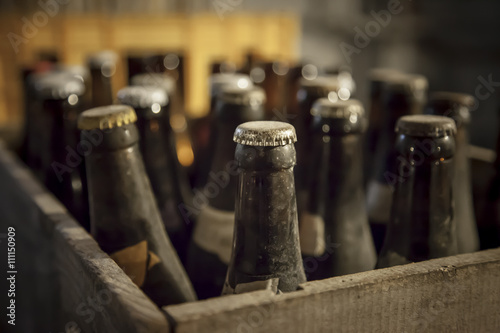 Old dusty bottle of beer.