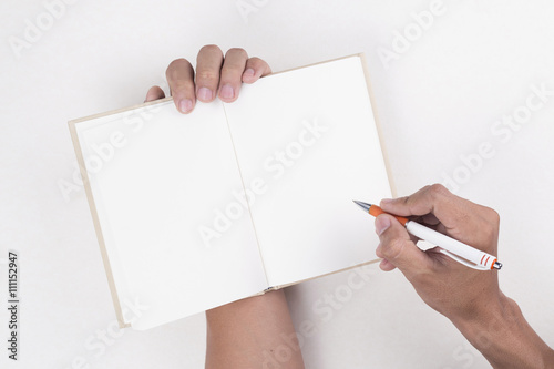 hand writing on blank notebook