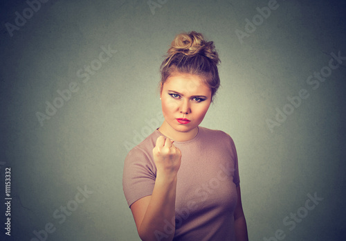 Fotografija Angry young woman with fist up