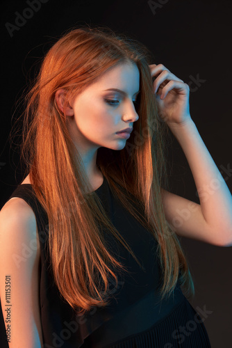 Fashion portrait of beautiful red haired girl