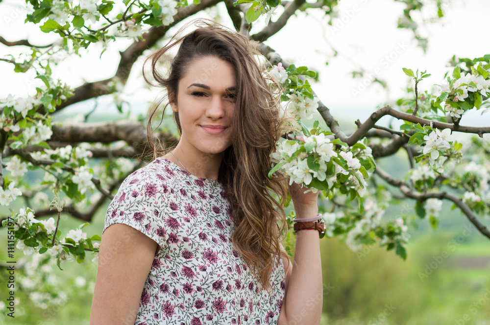 Romantic young woman portrait in blooming spring season Romantic young woman portrait in blooming spring season