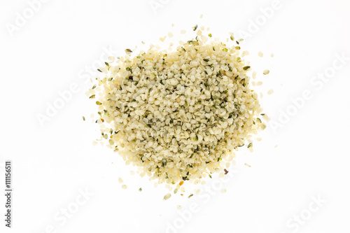 Heap of blanched hemp seeds , on white background