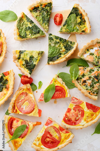 slices quiche with fish and spinach