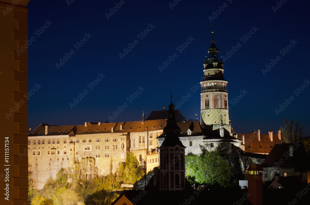 Night view of castle tower in Cesky Krumlov. Czech republic landmark, UNESCO World Heritage Site.