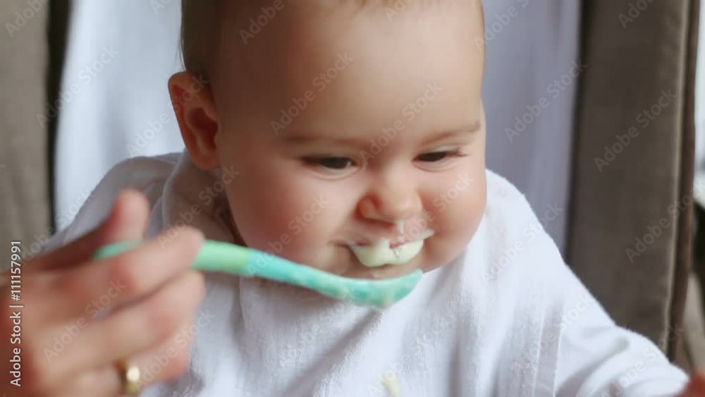 Hungry and happy baby girl eating
Hungry and happy baby girl eating