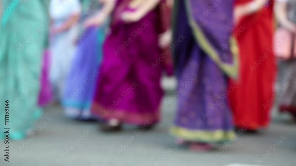 Women in Hindu traditional colorful costumes, dancing on the street, defocused video Women in Hindu traditional colorful costumes, dancing on the street, defocused video