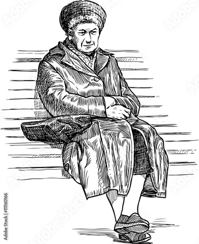 old woman resting on a park bench