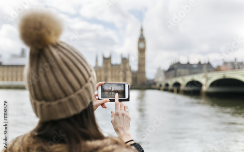 Young couple taking a selfie at a cafe photo