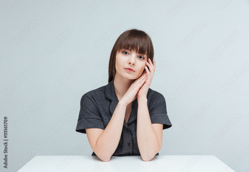 Attractive woman sitting at the table Attractive woman sitting at the table