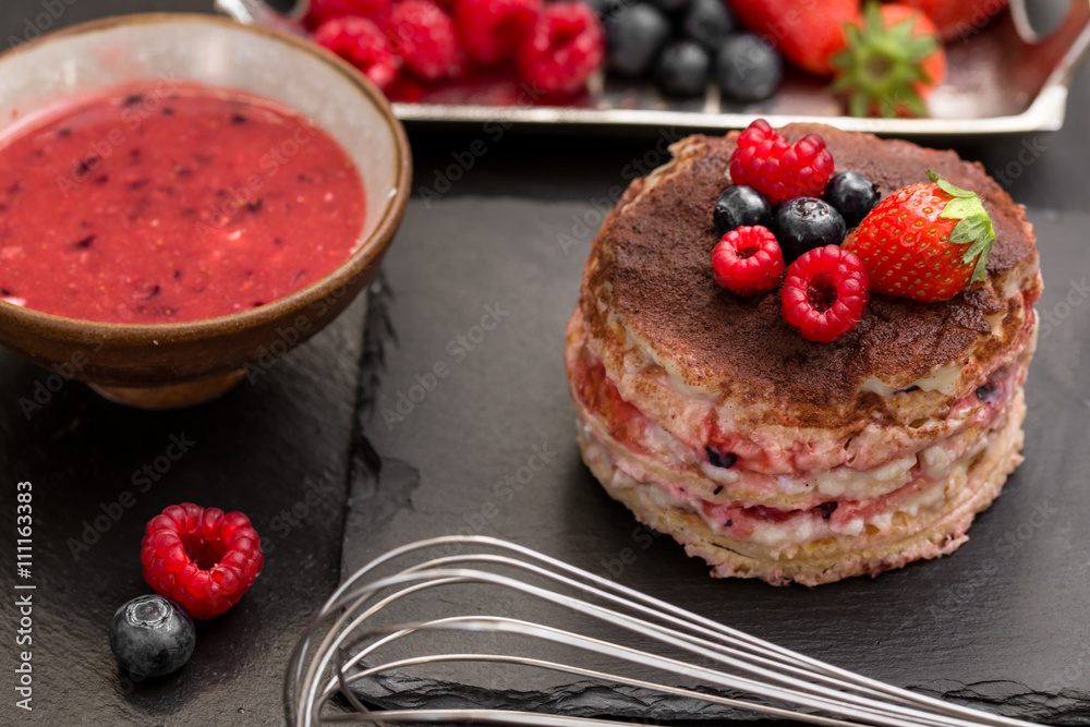 homemade tiamisu with custard cream and berry fruits over slate homemade tiamisu with custard cream and berry fruits over slate