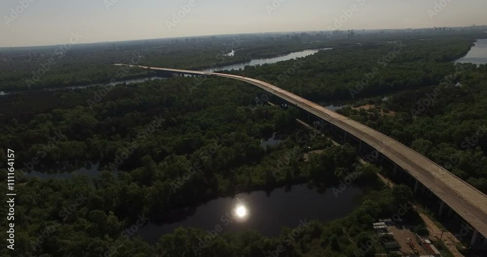 Aerial view of abandoned unfinished transport bridge over the city and the forest in Kyiv, Ukraine Aerial view of abandoned unfinished transport bridge over the city and the forest in Kyiv, Ukraine