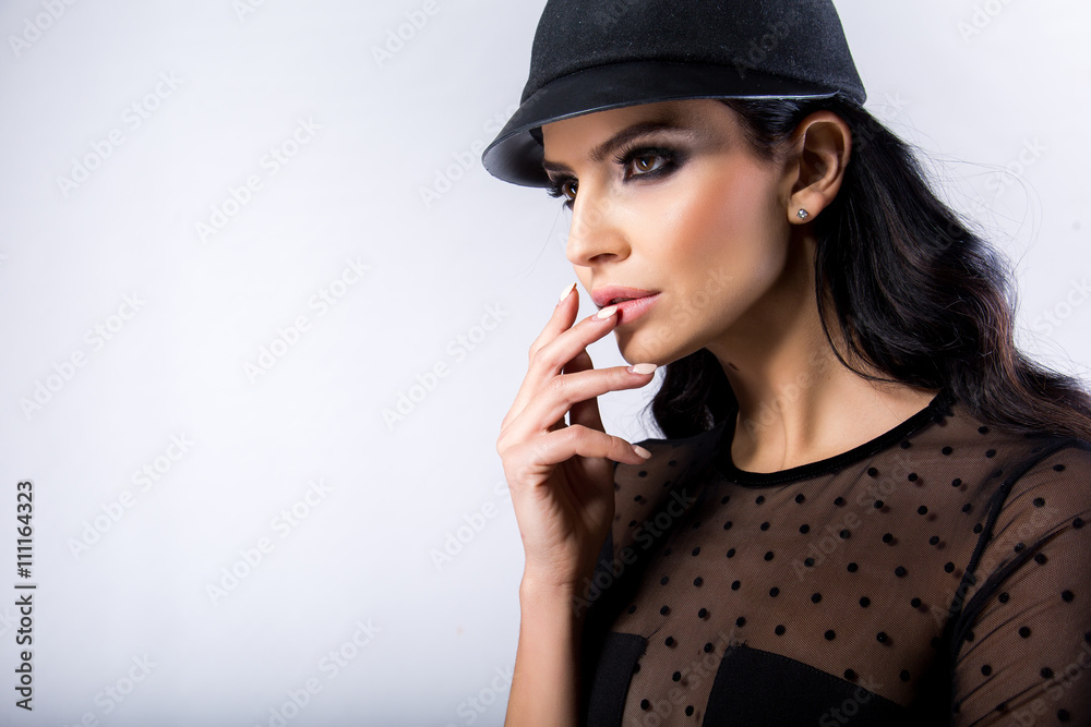 Portrait of beautiful young sexy woman with makeup and a hat Portrait of beautiful young sexy woman with makeup and a hat