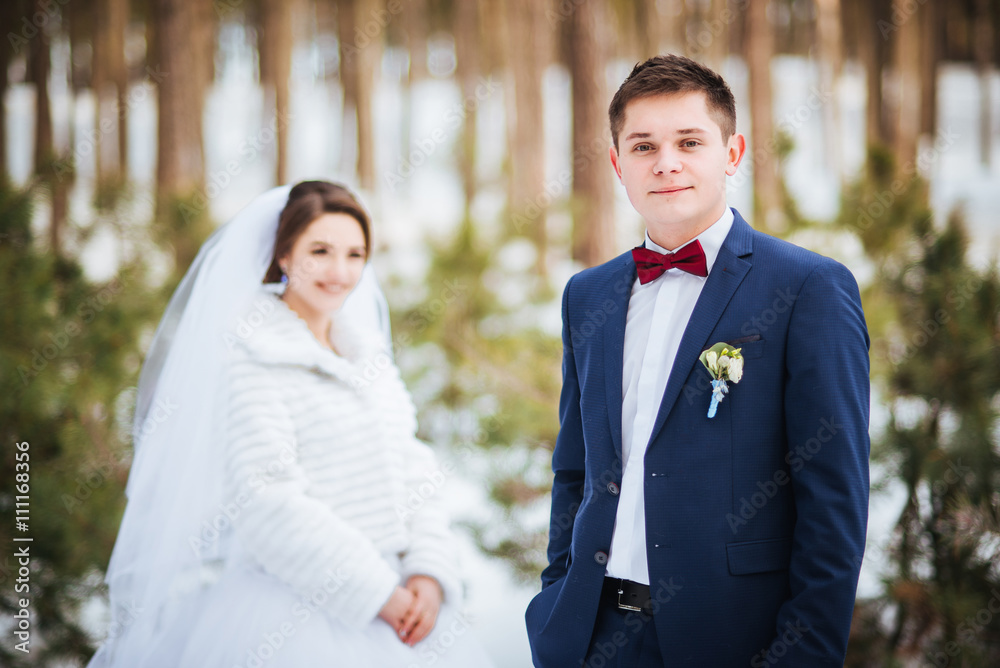 Happy bride and groom in winter day on their wedding Happy bride and groom in winter day on their wedding