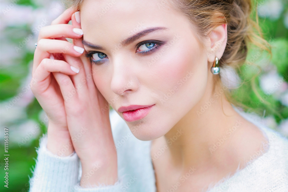 Beautiful woman closeup portrait in spring blooming garden Beautiful woman closeup portrait in spring blooming garden