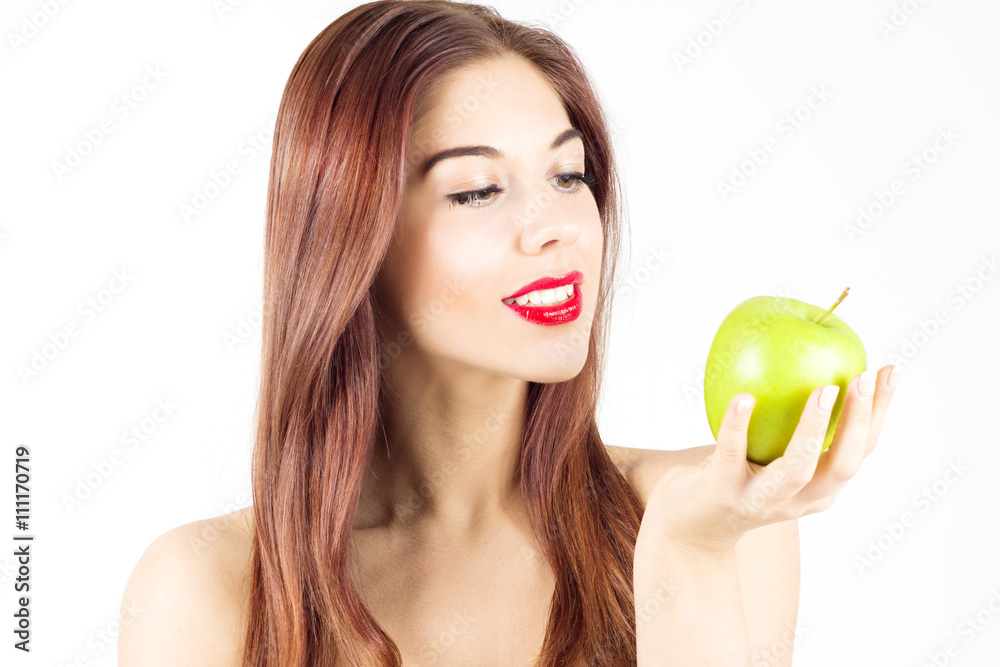 Portrait of beauty smiling woman looking at green apple. Healthy diet and nutrition. Smile with white teeth. Portrait of beauty smiling woman looking at green apple. Healthy diet and nutrition. Smile with white teeth.