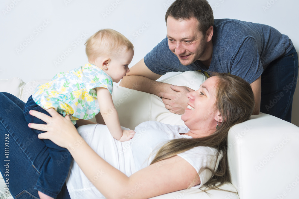 Obraz premium Mother with baby on the sofa taking good time