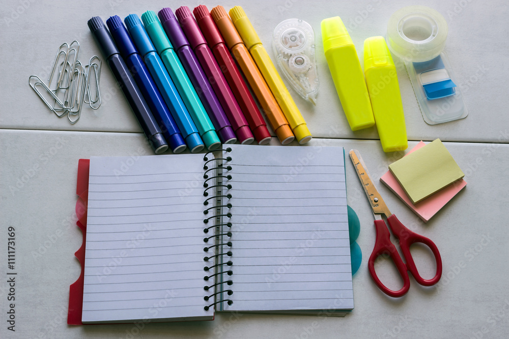 School supplies, notepad, markers, scissors, paper clips School supplies, notepad, markers, scissors, paper clips