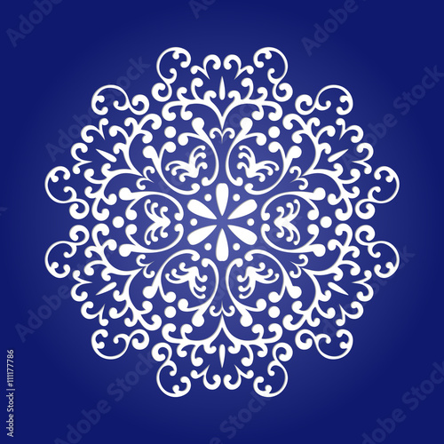 Die cut paper card with cutout mandala ornament. 