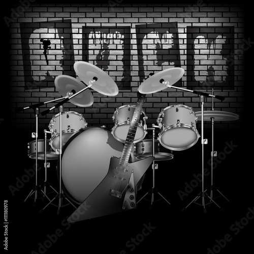 drum set with electric guitar rock and brick wall
