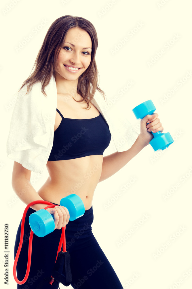 Woman with dumbbell, ball and expander