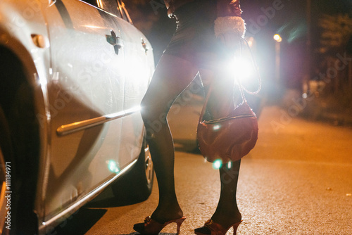 Roadside prostitute at night photo