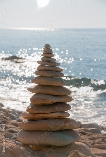 Balanced stones on a pebble beach