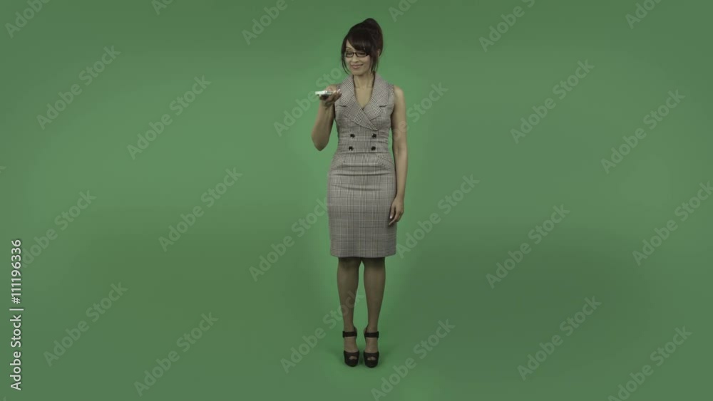 indian business woman isolated on green talking with cell phone indian business woman isolated on green talking with cell phone