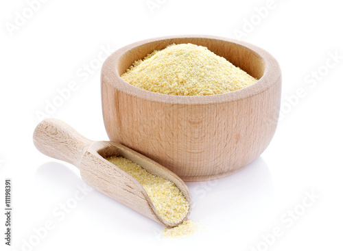 Corn grits in wooden bowl photo