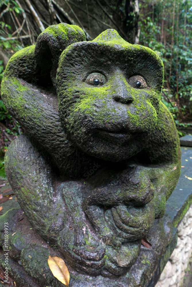 Fototapeta premium Old monkey sculpture in jungle, Sacred Monkey Forest Sanctuary.