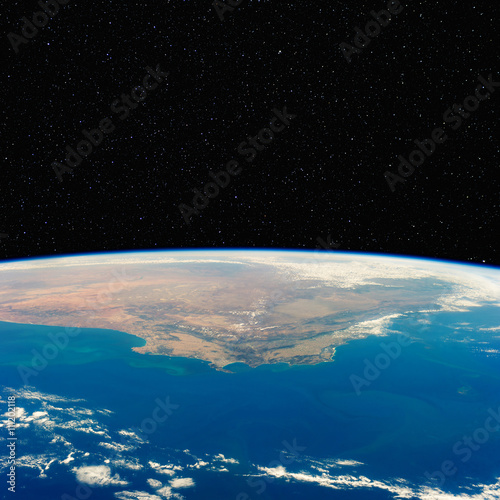 Fototapeta Naklejka Na Ścianę i Meble -  South Africa from space with stars above. Includes NASA data.