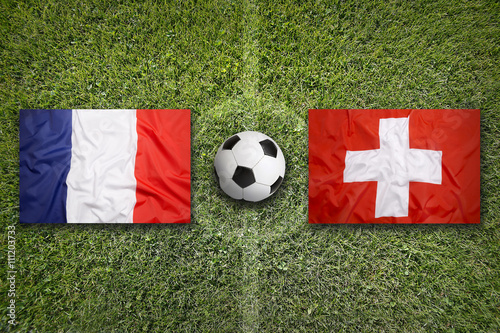 France vs. Switzerland flags on soccer field