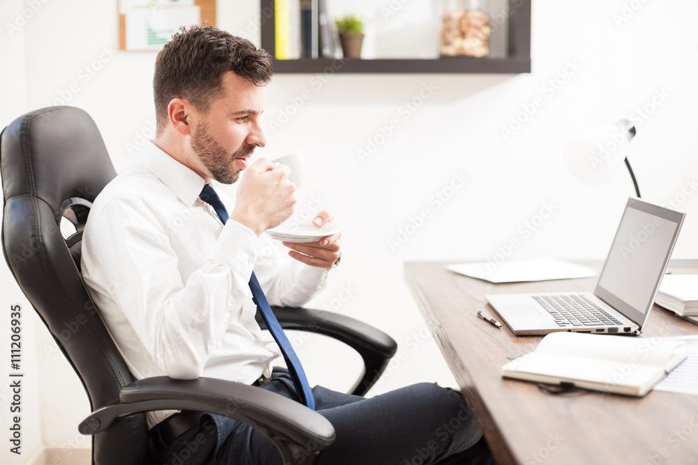 Businessman enjoying a cup of coffee Businessman enjoying a cup of coffee