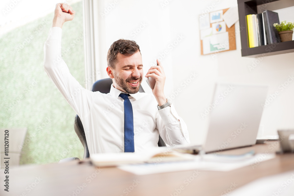 Businessman just got a new client over the phone