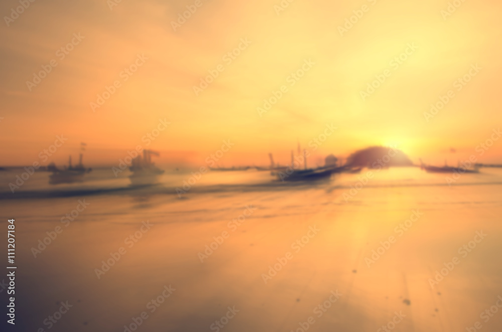 Motion blur tropical sunset beach abstract background.