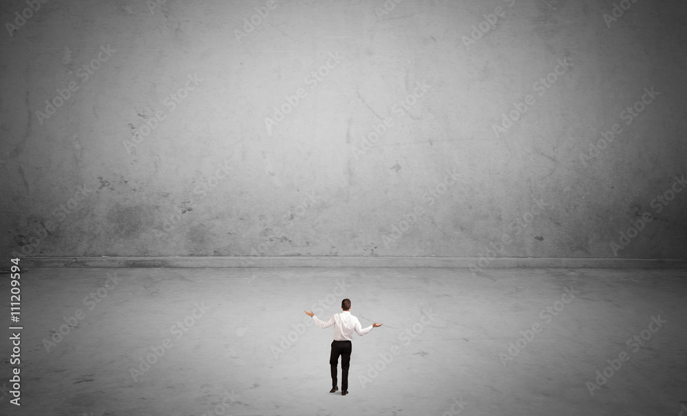 Small business person in large empty space Small business person in large empty space